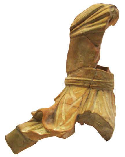 The broken piece of the Mithras statuette.
